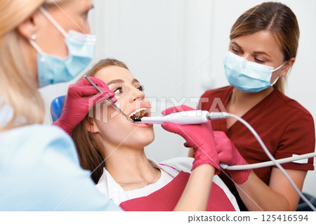 dentist concept, dental explorer, Stomatology cabinet, dental tools, examination patient, dental procedure, professional orthodontic clinic dentist concept, dental explorer, Stomatology cabinet, dental tools, examination patient, dental procedure, professional orthodontic clinic 125416594