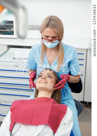 generous facial joints, osteopath performs, facial massage joints, checking teeth, oral care, healthy teeth, Dental treatment generous facial joints, osteopath performs, facial massage joints, checking teeth, oral care, healthy teeth, Dental treatment 125416632