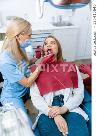dentist examining, dentist examine tooth, dental instruments, examination patient, checking teeth, dentist showing, professional doctor fixing teeth, healthy smile dentist examining, dentist examine tooth, dental instruments, examination patient, checking teeth, dentist showing, professional doctor fixing teeth, healthy smile 125416640