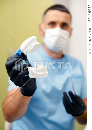 Dental care, dental procedure, healthy teeth, dental tools, stomatological cabinet, dentistry professional, doctor fixing teeth Dental care, dental procedure, healthy teeth, dental tools, stomatological cabinet, dentistry professional, doctor fixing teeth 125416655