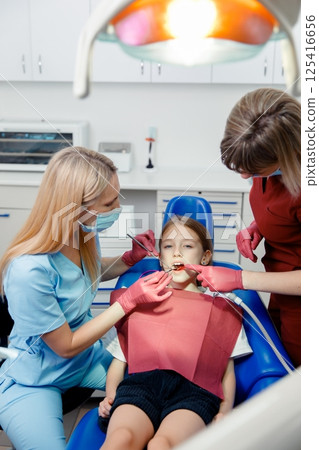 checking teeth, child dentist patient, Professional stomatology kid, professional doctor fixing teeth, dental specialist checking teeth, child dentist patient, Professional stomatology kid, professional doctor fixing teeth, dental specialist 125416656