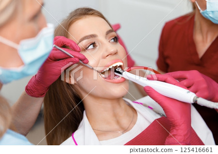 dental examination, dental health, checking teeth, hospital office, smiling patient, dentistry clinic, dental chair, consultation 125416661