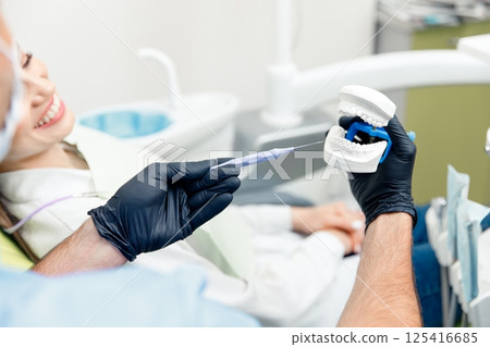 Dental care, dental procedure, healthy teeth, dental tools, stomatological cabinet, dentistry professional, doctor fixing teeth Dental care, dental procedure, healthy teeth, dental tools, stomatological cabinet, dentistry professional, doctor fixing teeth 125416685