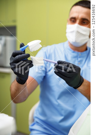 Dental treatment, Dentist checking teeth, dental examination, smiling woman, dental procedure, treating teeth, female at a dental clinic smiling Dental treatment, Dentist checking teeth, dental examination, smiling woman, dental procedure, treating teeth, female at a dental clinic smiling 125416692