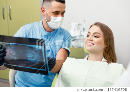 x-ray dentist, Smiling dentist, Showing X-ray dentist, male doctor examining, dentist showing, medical dentist center, consultation dental clinic 125416708