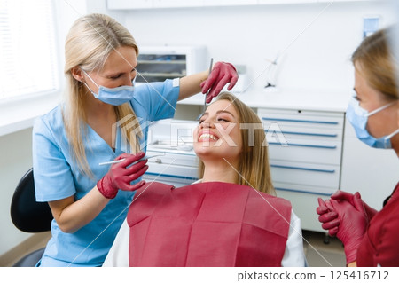 dentist examining, dentist examine tooth, dental instruments, examination patient, checking teeth, dentist showing, professional doctor fixing teeth, healthy smile dentist examining, dentist examine tooth, dental instruments, examination patient, checking teeth, dentist showing, professional doctor fixing teeth, healthy smile 125416712