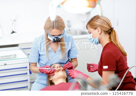 dental specialist, teeth check, dental diagnosis, dental care, dental examination, professional doctor fixing teeth, healthy teeth 125416779