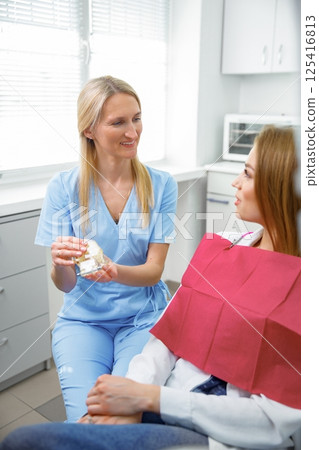 dental consultation, dentist checking teeth, dental examination, healthy teeth, dentist office, professional orthodontic clinic 125416813