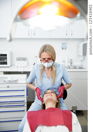 generous facial joints, osteopath performs, facial massage joints, checking teeth, oral care, healthy teeth, Dental treatment generous facial joints, osteopath performs, facial massage joints, checking teeth, oral care, healthy teeth, Dental treatment 125416901