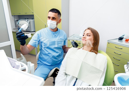 consultation dental clinic, checking teeth, male doctor examining, dentist concept, professional orthodontic clinic, dentist patient consultation dental clinic, checking teeth, male doctor examining, dentist concept, professional orthodontic clinic, dentist patient 125416906