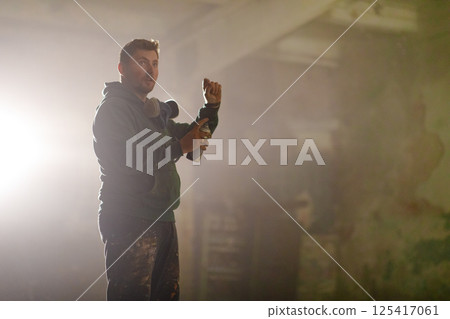 Soldier demonstrates skills using tactical gear in a low-light setting. The atmosphere suggests an intense training session aimed at enhancing operational effectiveness. Soldier demonstrates skills using tactical gear in a low-light setting. The atmosphere suggests an intense training session aimed at enhancing operational effectiveness. 125417061