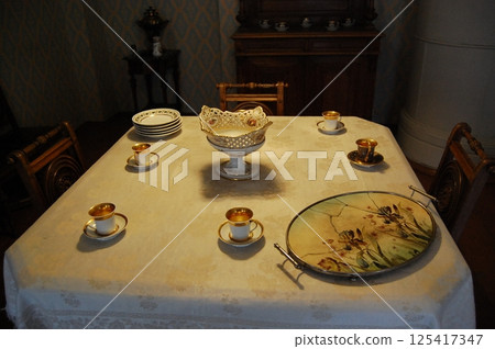 Elegant Vintage Dining Table with Fine Porcelain Elegant Vintage Dining Table with Fine Porcelain 125417347