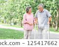 Happy senior couple walking in the park 125417662