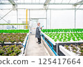 Happy senior Asian man in greenhouse 125417664