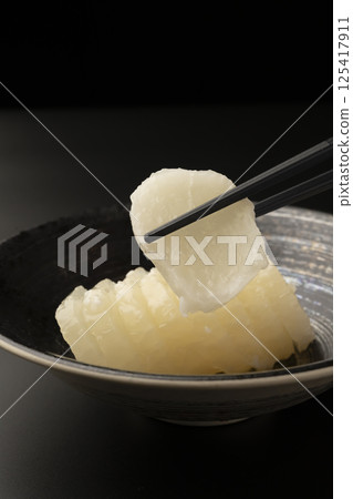 Bettara pickles on a black background 125417911