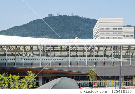 Nagasaki City, Nagasaki Prefecture: The rebuilt JR Nagasaki Station (with a parked Shinkansen train and Mount Inasa visible in the background) 125418133