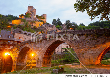 Old stony bridge dated 15th century over Aveyron river. Les Plus Beaux Villages de France (Most beautiful villages of France). Belcastel. France Old stony bridge dated 15th century over Aveyron river. Les Plus Beaux Villages de France (Most beautiful villages of France). Belcastel. France 125418697