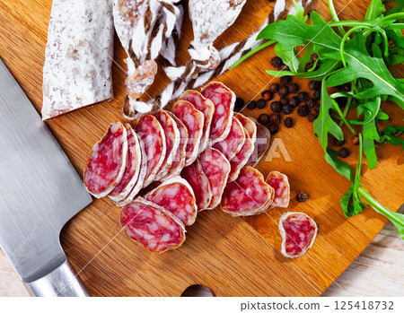 Sliced spanish sausage fuet Sliced spanish sausage fuet 125418732