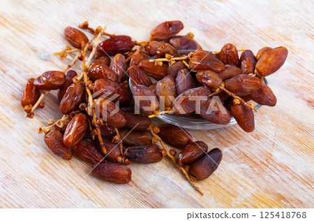 Close up of tropical dried fruits Kurma or dates, nobody Close up of tropical dried fruits Kurma or dates, nobody 125418768