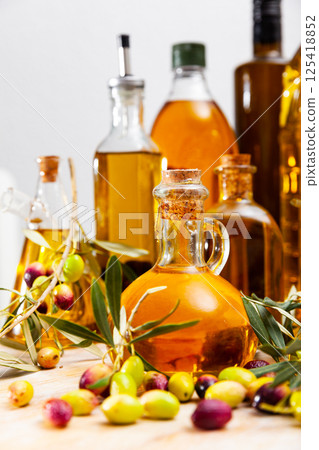 Decanters and bottles with olive oil 125418852