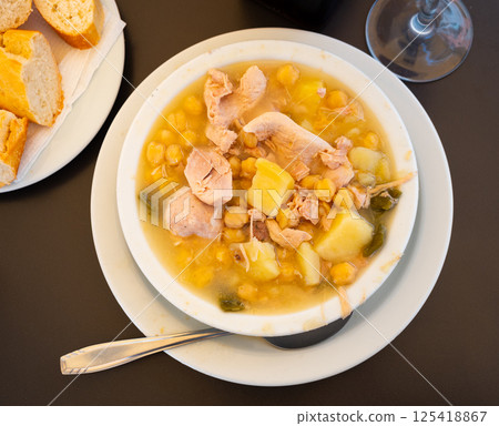 Popular dish of Spanish cuisine is Cocido de garbanzos 125418867