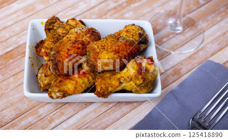 Crispy deep fried chicken wings served on plate Crispy deep fried chicken wings served on plate 125418890