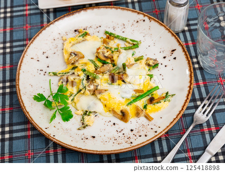 Popular breakfast of Spanish cuisine is Revuelto Popular breakfast of Spanish cuisine is Revuelto 125418898
