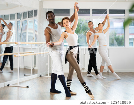 Man and woman perform paired ballet dance Man and woman perform paired ballet dance 125418999
