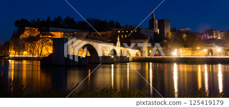 Avignon Bridge with Popes Palace, Pont Saint-Benezet at dusk 125419179