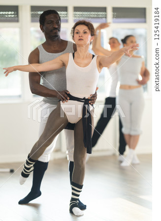 Man and woman rehearsing a couple ballet dance together in studio Man and woman rehearsing a couple ballet dance together in studio 125419184