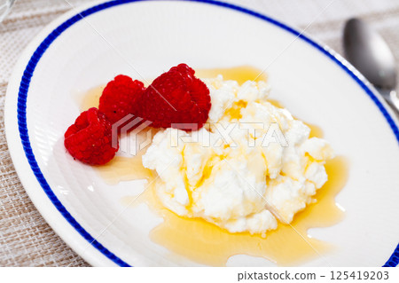 Mato with honey and strawberry - traditional catalan dessert closeup Mato with honey and strawberry - traditional catalan dessert closeup 125419203