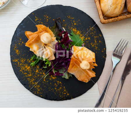 Filo dough bags stuffed with meat and vegetables Filo dough bags stuffed with meat and vegetables 125419235