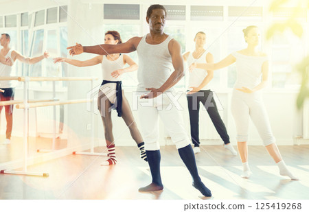 Group of dancers rehearsing ballet dance Group of dancers rehearsing ballet dance 125419268