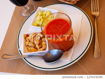 Glass of gazpacho with cucumber and croutons 125419280