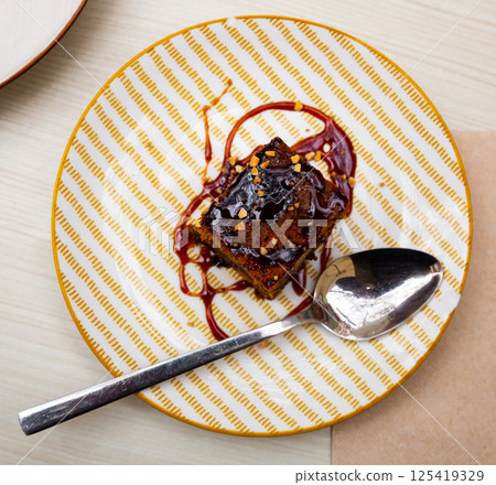 Slice of fresh carrot cake served on plate 125419329