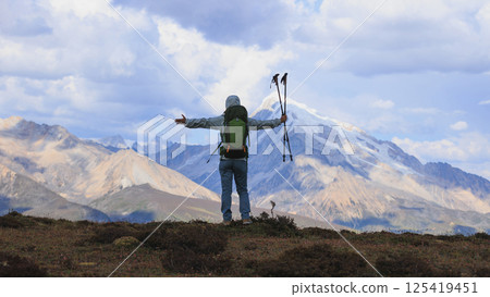 Woman hiking on high altitude mountain top Woman hiking on high altitude mountain top 125419451