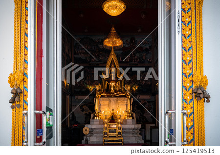 Chachoengsao, Thailand, March 16, 2025, Majestic Buddha statue in the Wat Hong Thong temple illuminated by soft lights. Chachoengsao, Thailand, March 16, 2025, Majestic Buddha statue in the Wat Hong Thong temple illuminated by soft lights. 125419513