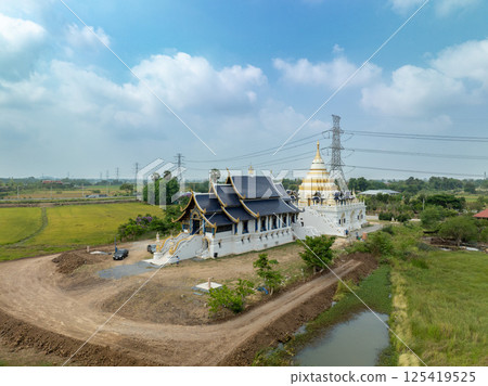 Lopburi, Thailand, April 07, 2024, Visit to Wat Phra Nang Chamathewi, S howcasing its stunning architecture on a clear April day amidst serene landscapes 125419525
