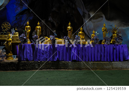 Lopburi, Thailand, April 14, 2025, Golden Buddha statues adorned with flowers at Wat Tamtako Lopburi, Thailand, April 14, 2025, Golden Buddha statues adorned with flowers at Wat Tamtako 125419559