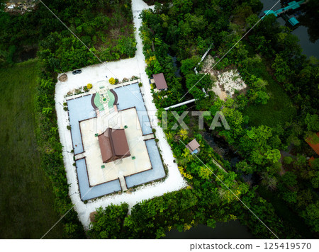 Lopburi, Thailand, April 15, 2025, Wat Pa Thammawisut Mongkhon surrounded by lush greenery and pathways Lopburi, Thailand, April 15, 2025, Wat Pa Thammawisut Mongkhon surrounded by lush greenery and pathways 125419570