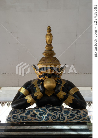 Nakhon Pathom, Thailand, December 29, 2024, Majestic statue at Wat Srisathong showcasing intricate details and historical significance in December 125419583