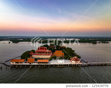 Samut Prakan, Thailand, January 19, 2025, Wat Khun Samutrawat showcases serene waterfront views at sunset Samut Prakan, Thailand, January 19, 2025, Wat Khun Samutrawat showcases serene waterfront views at sunset 125419770
