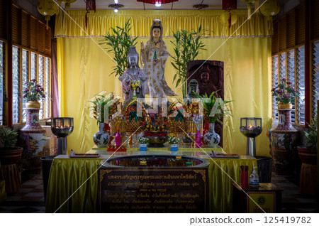 Singburi, Thailand, March 23, 2025, Wat Phra Non Chak Si Worawihan shrine, showcases colorful statues and offerings Singburi, Thailand, March 23, 2025, Wat Phra Non Chak Si Worawihan shrine, showcases colorful statues and offerings 125419782