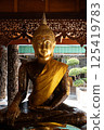 Singburi, Thailand, March 23, 2025, Golden Buddha statue observed at Wat Phra Non Chak Si Worawihan 125419783
