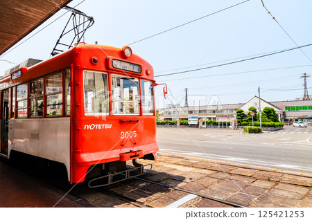 Ehime Iyo Railway - City tram 2000 series and Matsuyama Station 2nd generation station building - 125421253