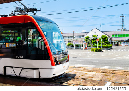 Ehime Iyo Railway - City tram 5000 series and Matsuyama Station 2nd generation station building - 125421255