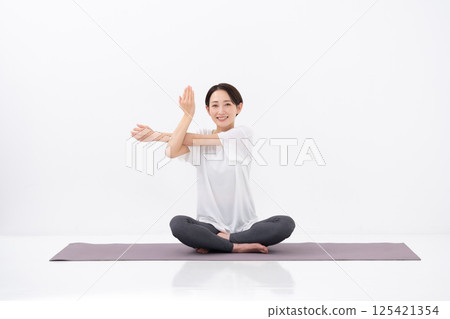 Woman doing yoga, middle-aged 125421354