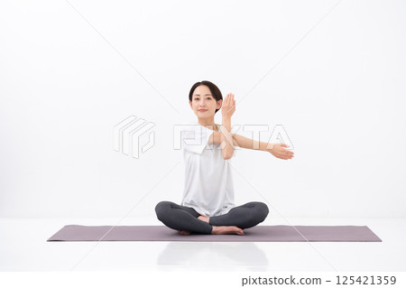 Woman doing yoga, middle-aged 125421359