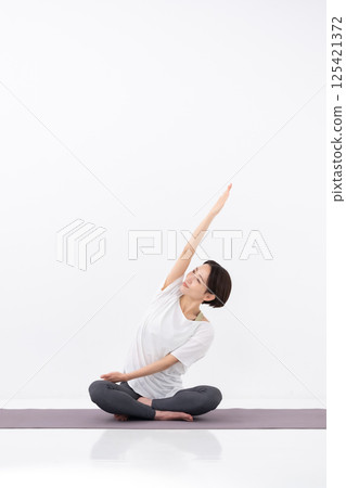 Woman doing yoga, middle-aged 125421372