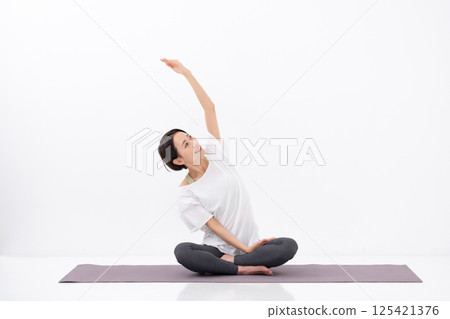 Woman doing yoga, middle-aged 125421376